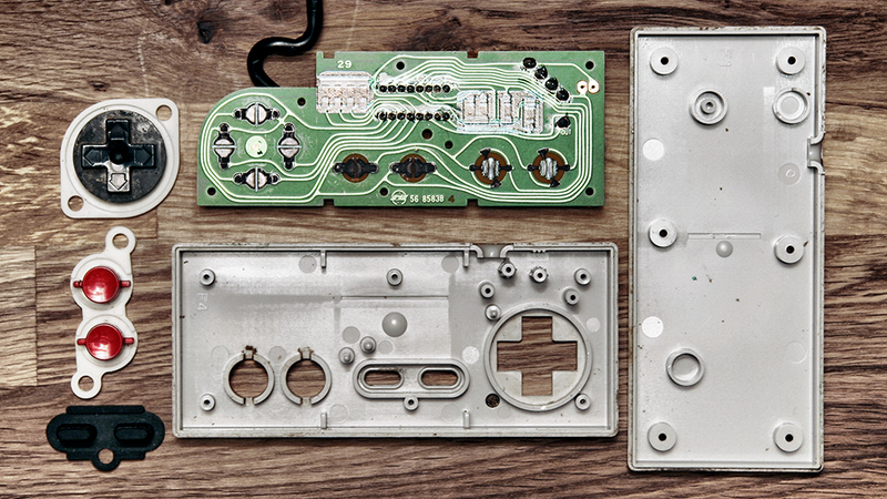 Illustration for article titled Deconstructed Gaming Controllers Reveal Gorgeous Old School Guts